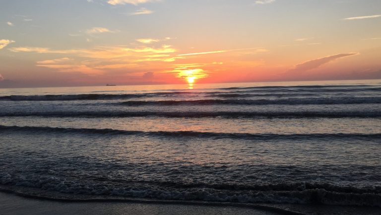 Sunrise over the waves at Cocoa Beach, Florida