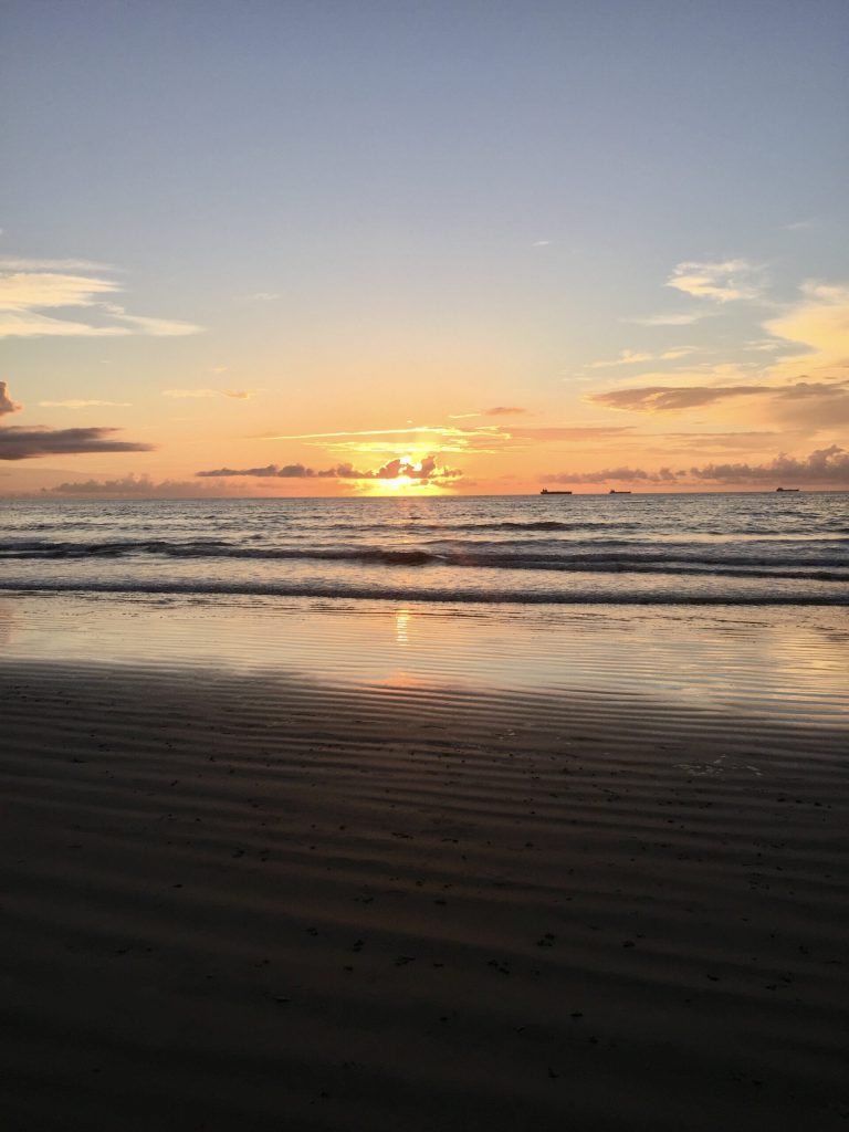 Sunrise with distant ships at Cocoa Beach, Florida