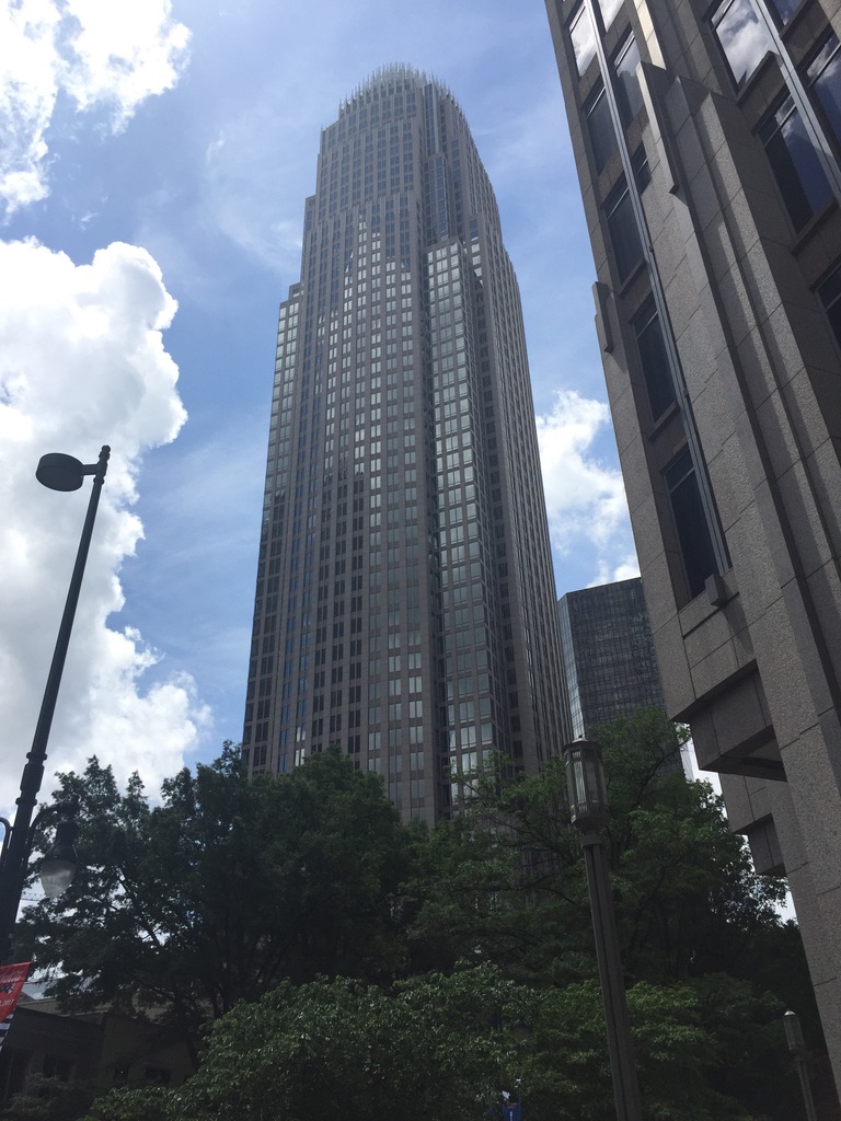 The crowned silhouette of the Bank of America Corporate Center on a bright spring day.