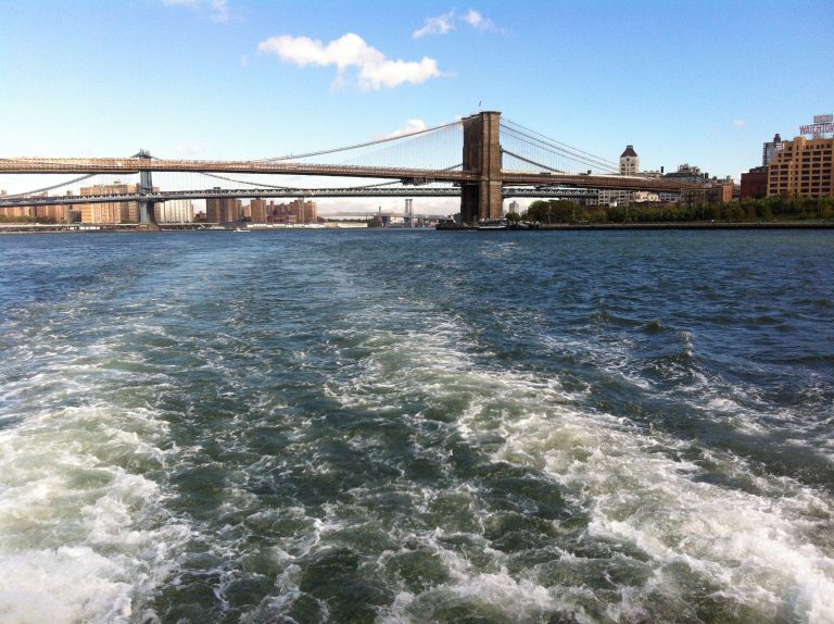 Looking up at the Brooklyn Bridge from a boat on the East River.