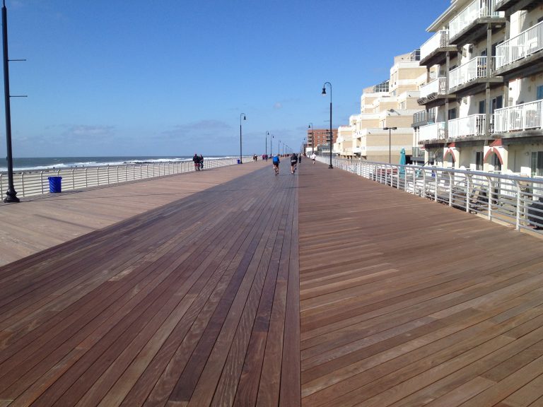 Cyclists on the Long Beach boardwalk on a sunny October morning.