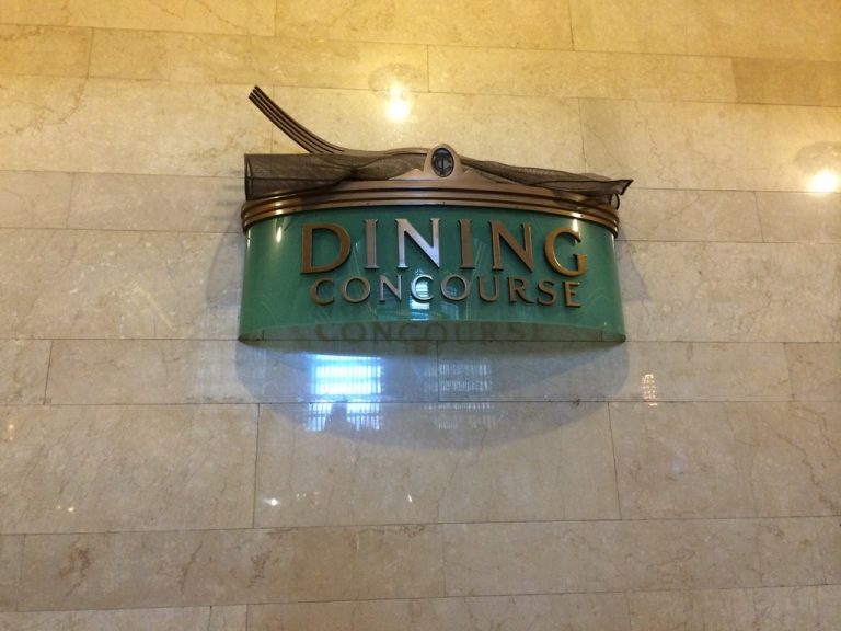 The bronze "Dining Concourse" sign marking the entrance to Grand Central's lower-level food court.