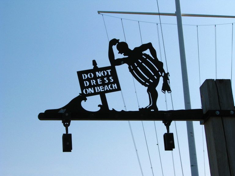 A vintage wrought-iron sign at Jones Beach with a sense of humor.