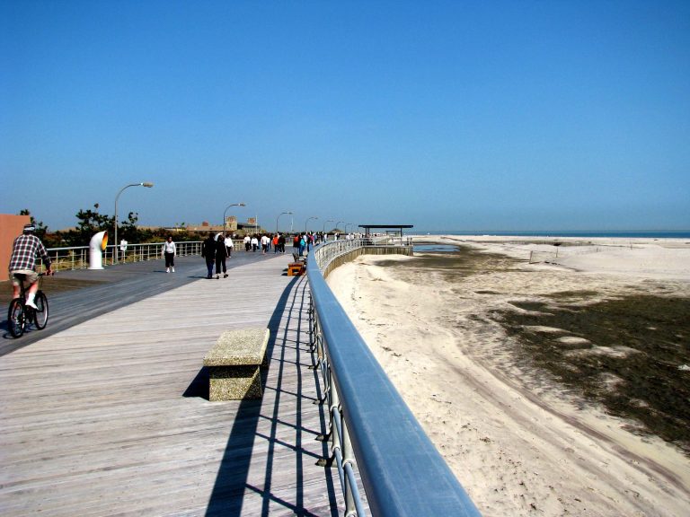 A bright winter afternoon along the curving Jones Beach boardwalk.