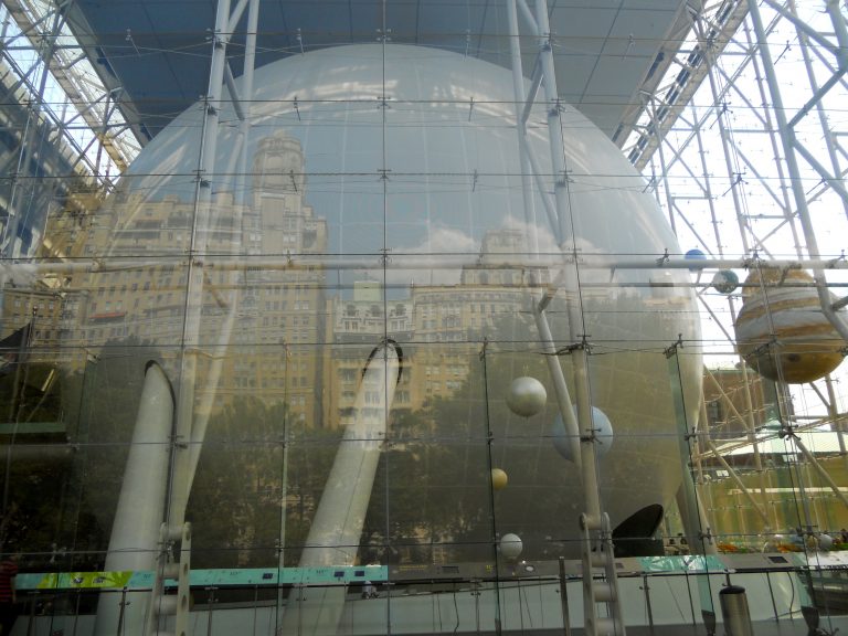 The gleaming Hayden Sphere, home to the Hayden Planetarium, rises within the glass cube of the Rose Center for Earth and Space at AMNH.