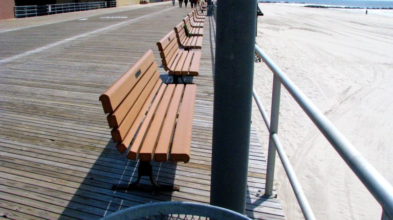 Empty benches on the Long Beach boardwalk.