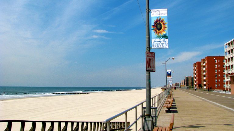 A sunflower banner brightens a lamp post on the Long Beach boardwalk.