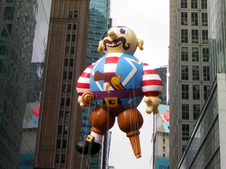 A cartoon pirate balloon glides through Midtown Manhattan — Macy's Thanksgiving Day Parade, New York City, 2009.