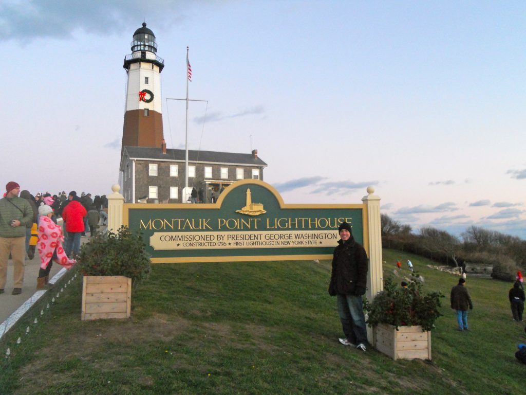 David Daniels standing in front of the Montauk Point Lighthouse