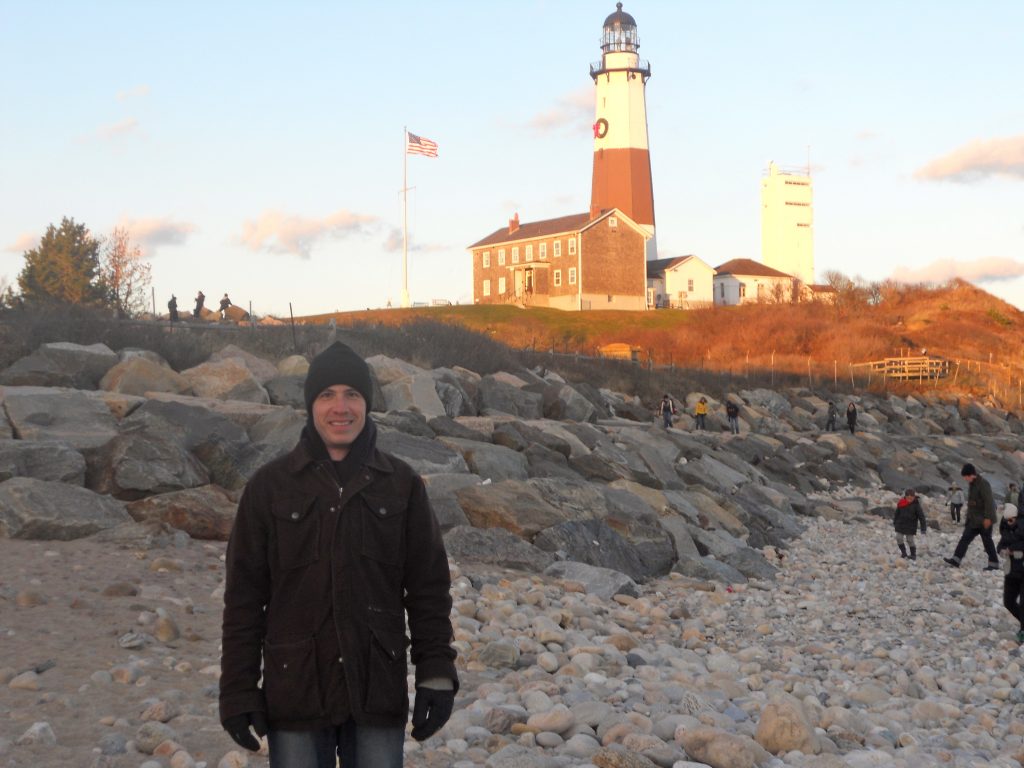 David Daniels standing on the rocks at Montauk Point